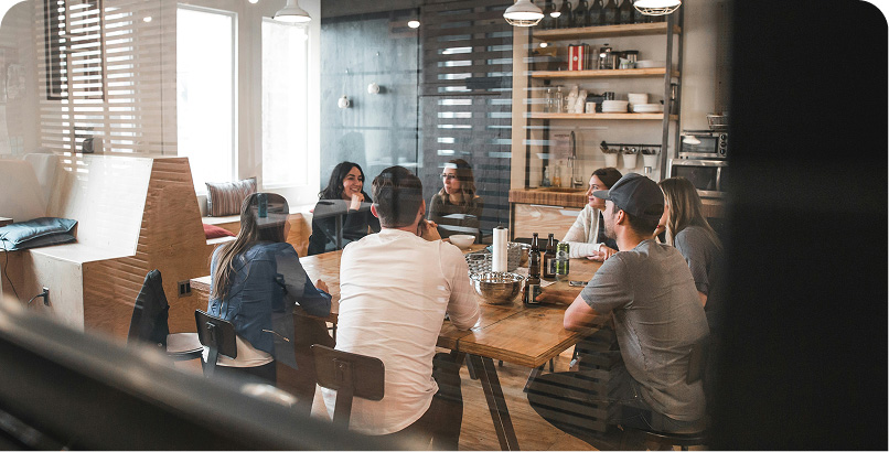 Employees working in a healthy office environment supported by Aeropulse indoor air quality monitoring solutions.